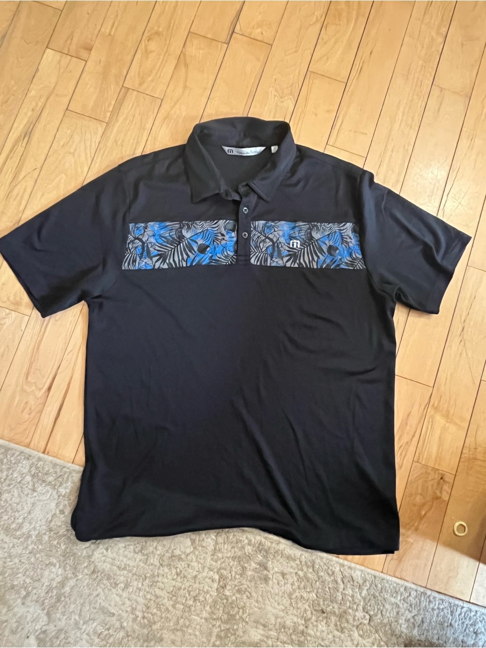 Travis Mathew Black Polo with Blue Leaf Chest Panel. Bundle and save